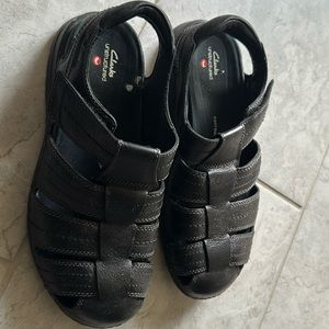 Fairly used Clarks fisherman sandals in color black, US size 11.